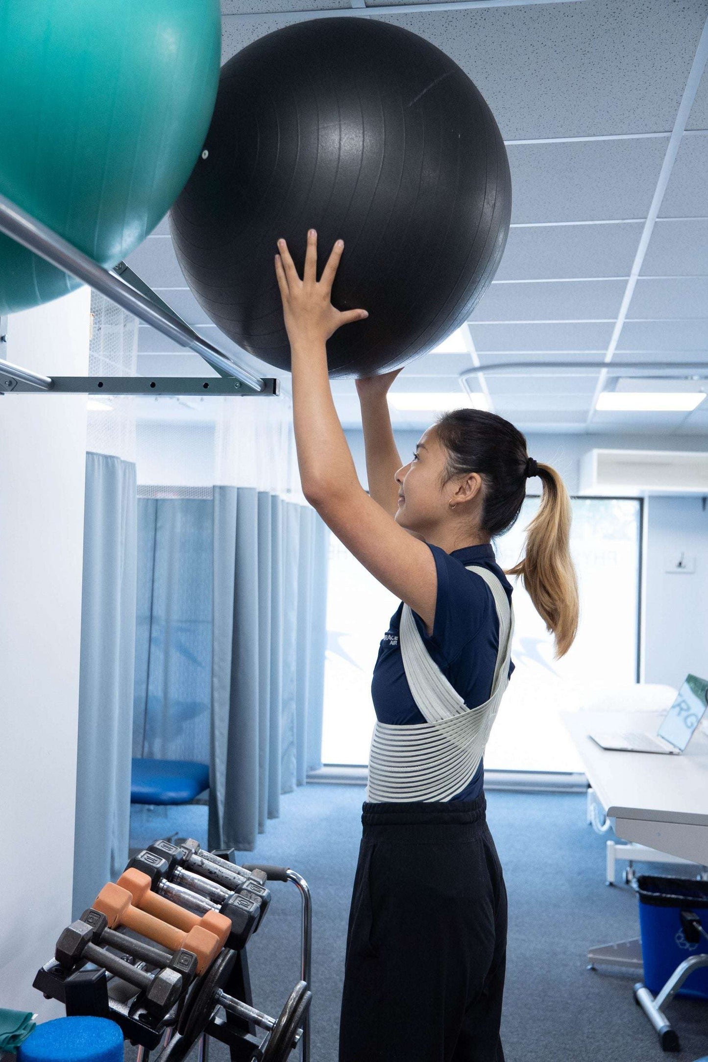 Clavicle support brace worn during exercise for improved posture.