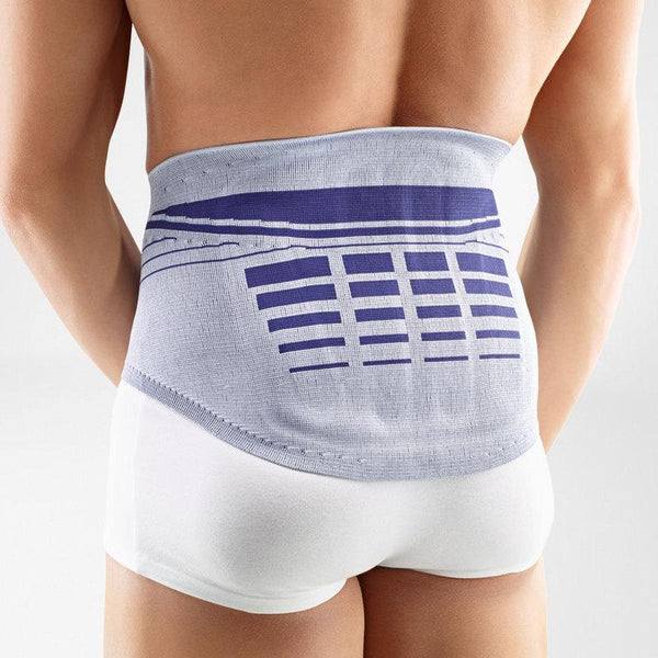 LumboLoc Back Brace on person, providing lumbar support with adjustable compression for pain relief.