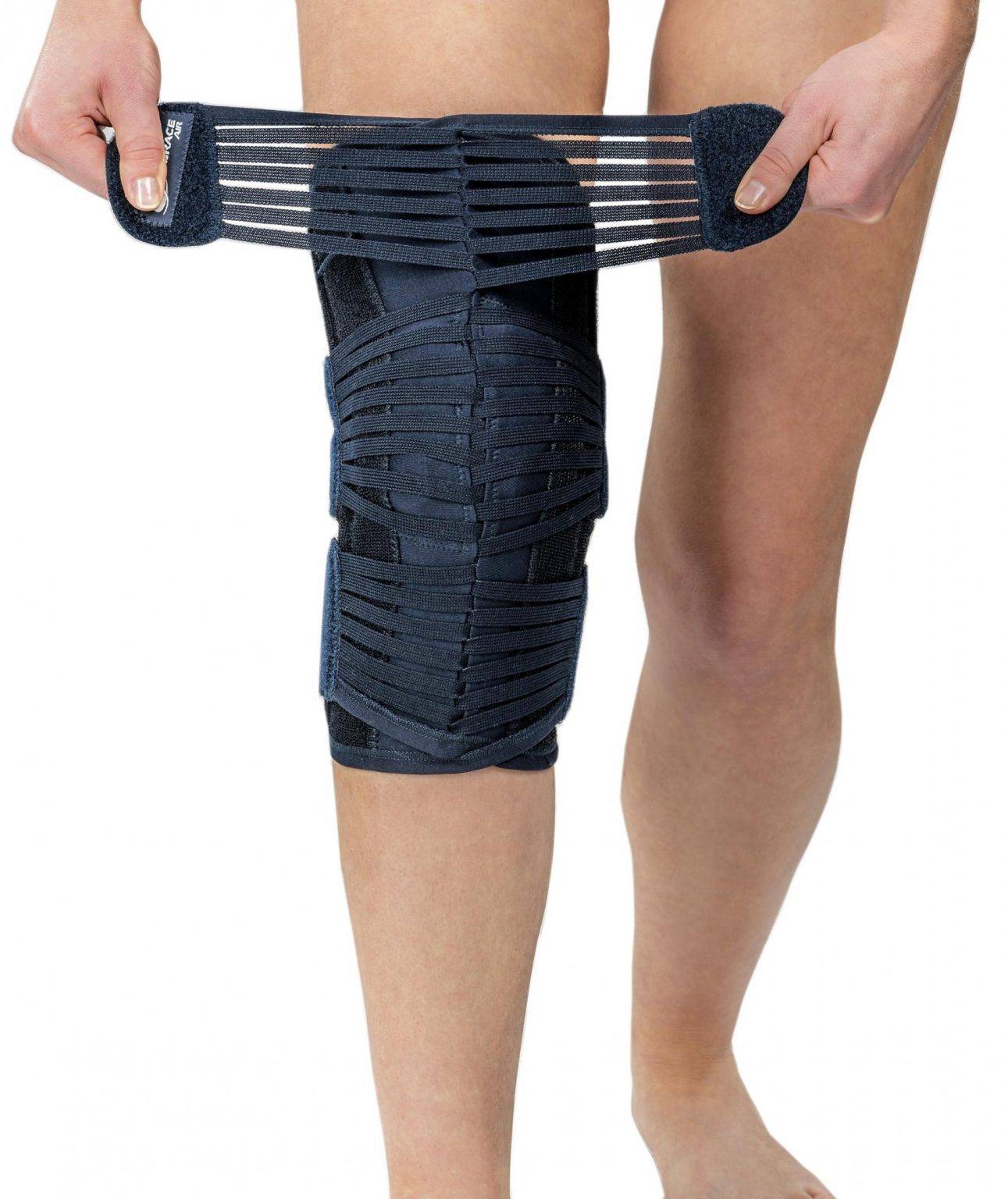 Knee brace with straps providing support for patella stabilization and injury protection.