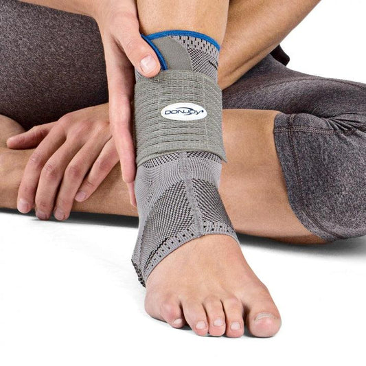 DonJoy AchilloForce Air Ankle Support with elastic knitted design and pneumatic air cells for Achilles tendon compression.