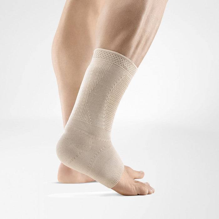 AchilloTrain Pro ankle brace providing stabilization and compression on a leg.