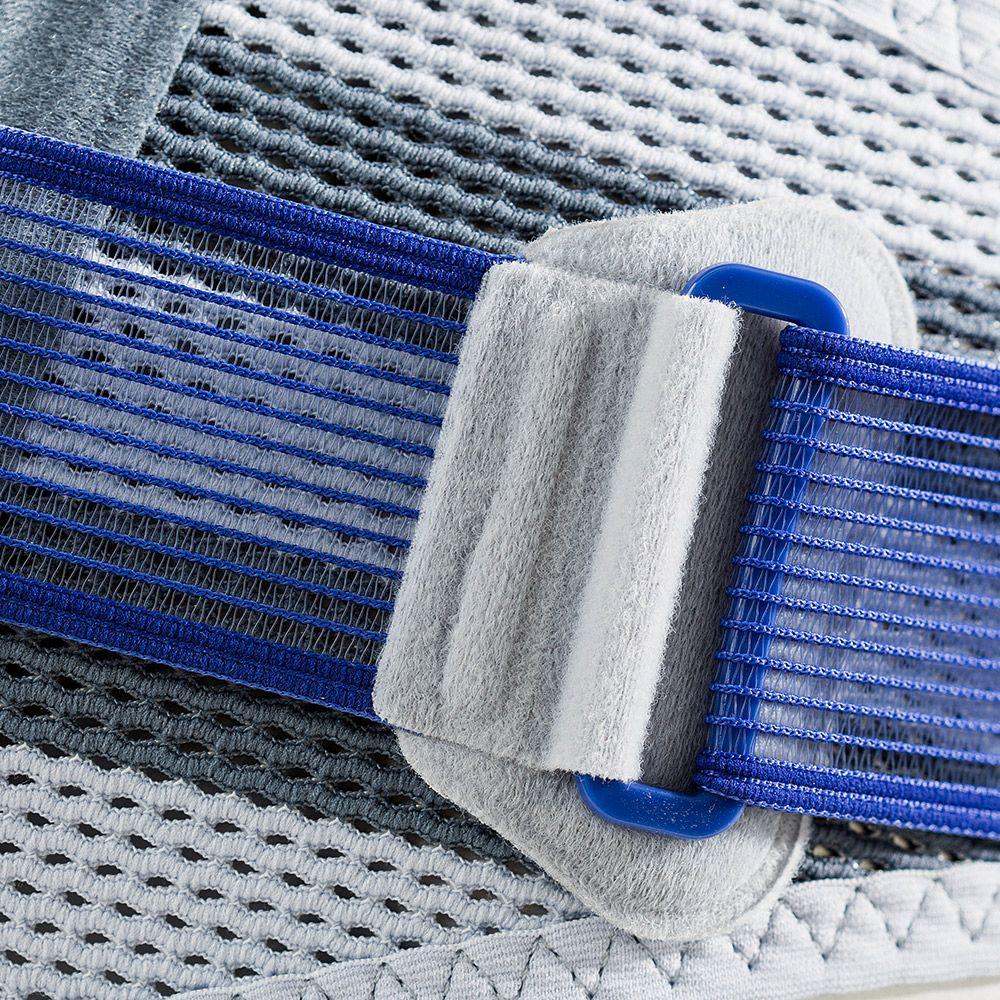SacroLoc Back Brace close-up showcasing tensioning strap and pad design.