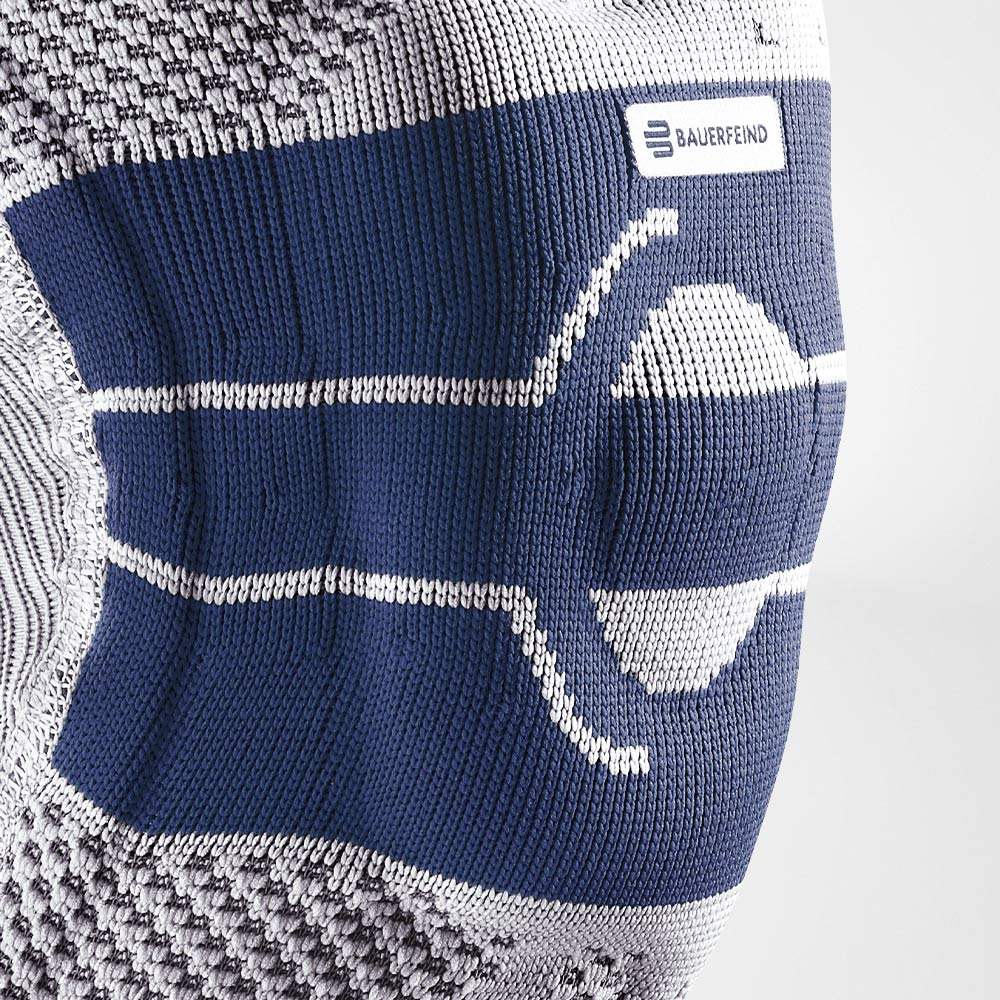 Close-up of the GenuTrain A3 knee brace showing its breathable knit fabric and integrated pad.