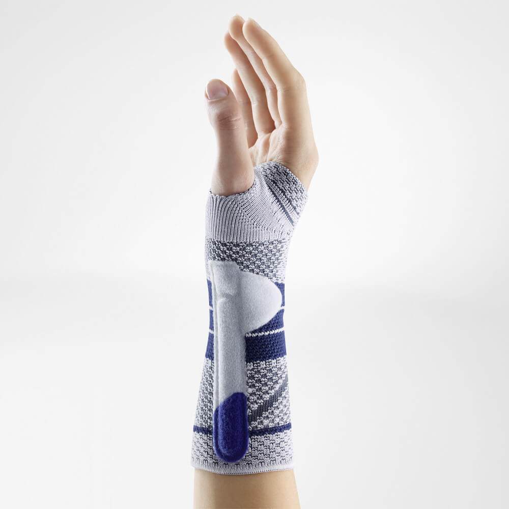 Bauerfeind ManuTrain Wrist Brace on hand, providing adjustable stabilization and compression for wrist support and pain relief.