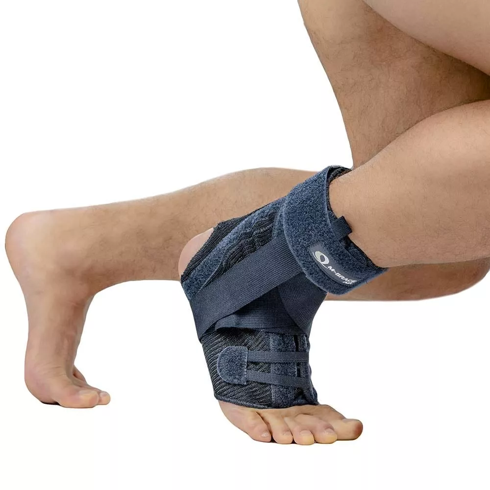 M-Brace Salto Ankle Stabilizer on foot for support and injury recovery.