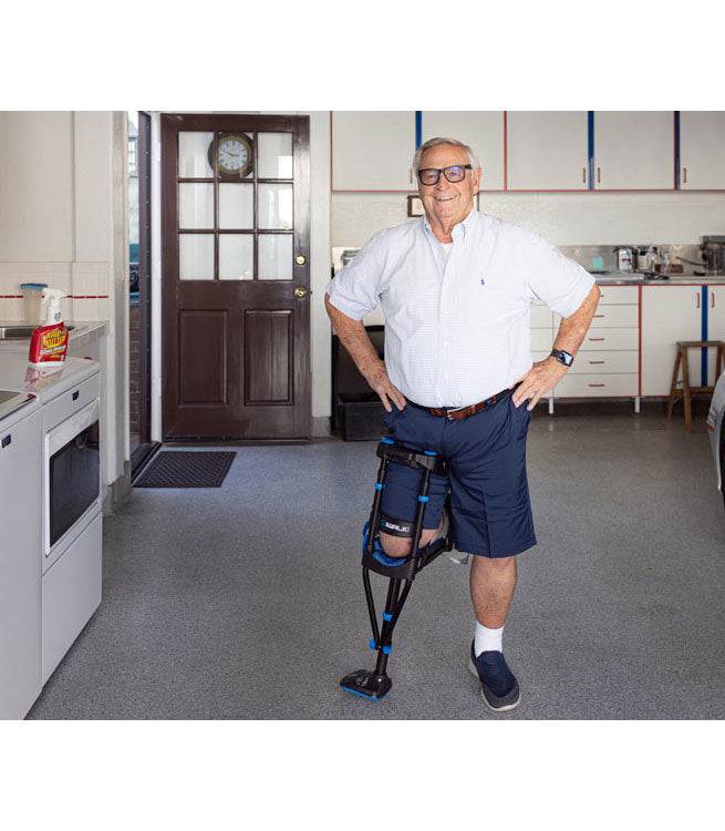 iWALK Crutch 3.0 in use, demonstrating hands-free mobility in a kitchen setting.