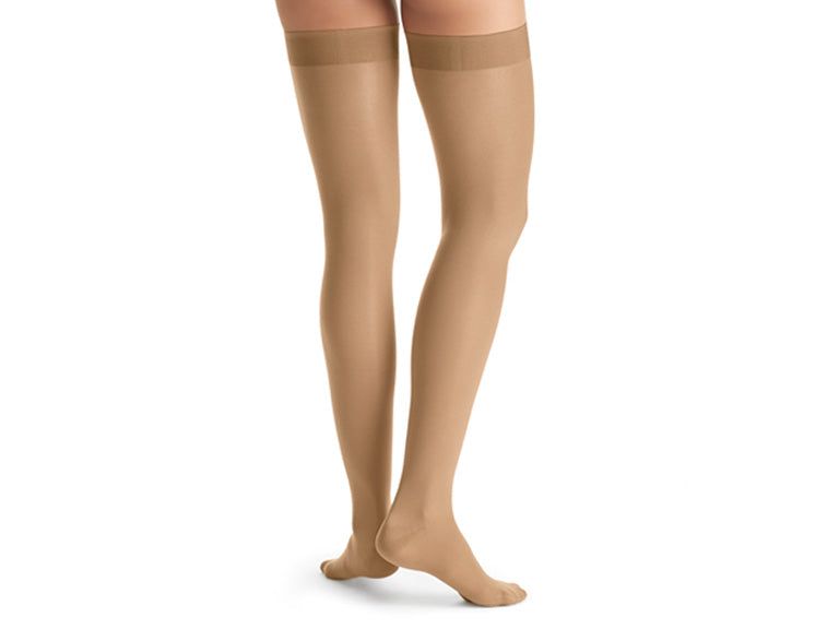 JOBST UltraSheer Waist High Closed Toe Compression Stockings in beige.