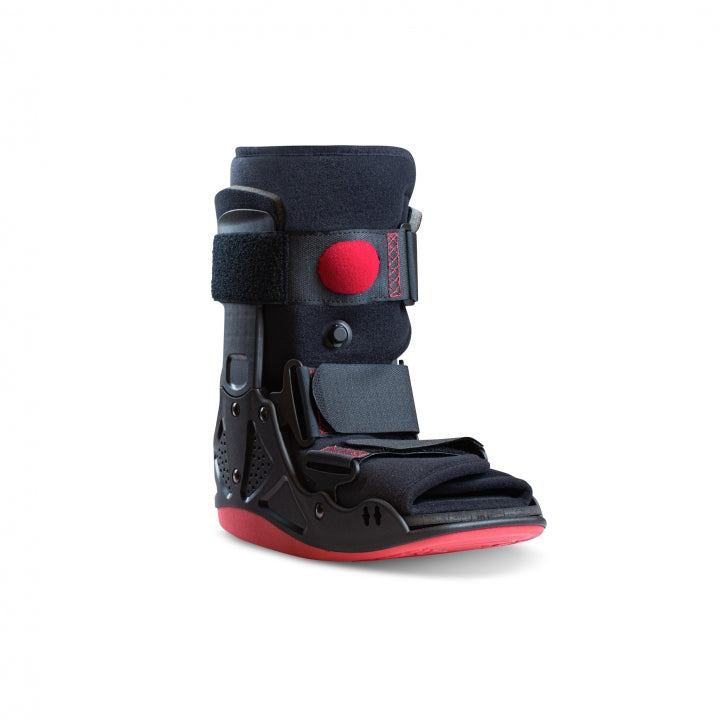 Low walking boot with air pump and cushioned soles for post-operative support.