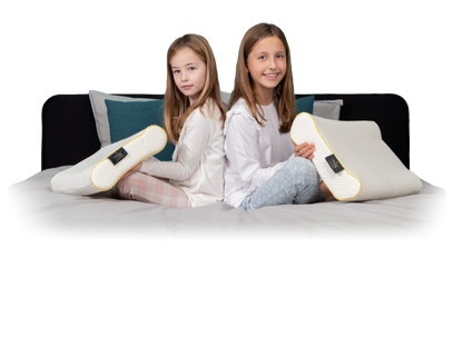 Pillowise Pediatric Pillow for kids providing ergonomic support on bed.