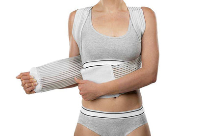 Clavicle support brace worn on shoulders for posture correction.