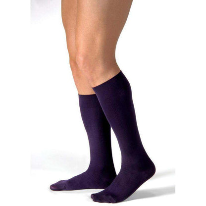 JOBST ForMen knee-high compression socks in purple, closed toe, ribbed design for men.