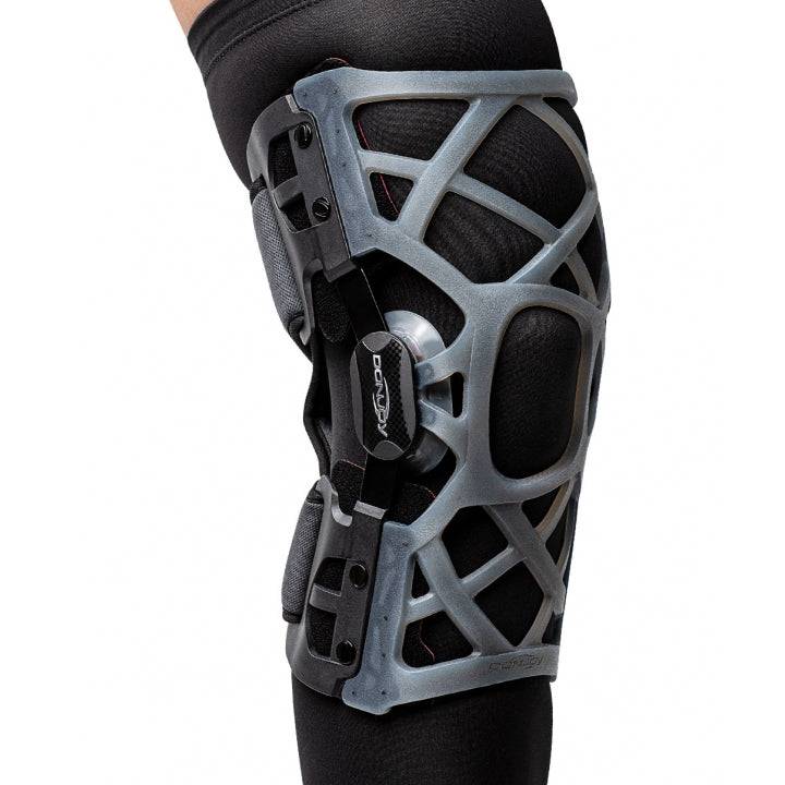 DonJoy OA Osteoarthritis Reaction WEB Knee Brace with silicone web design on leg.